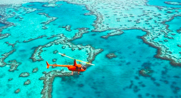 Heli over the reef.Photo credit @gsl_aviation on Instagram