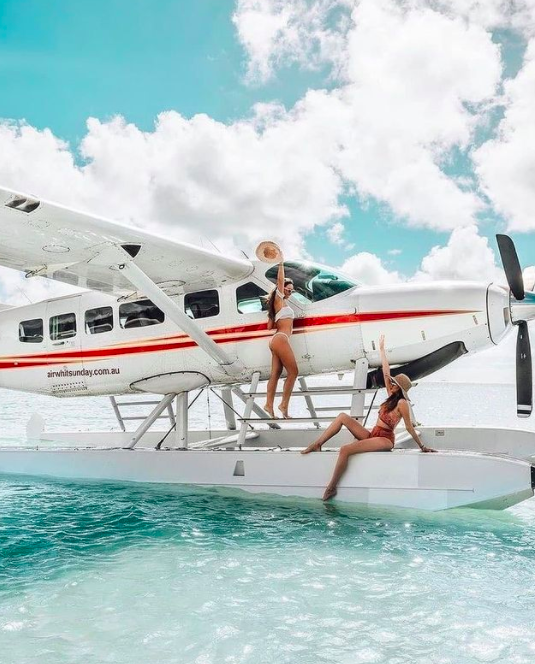 2 gals in Seaplane. Photo credit @flowtraveling on Instagram